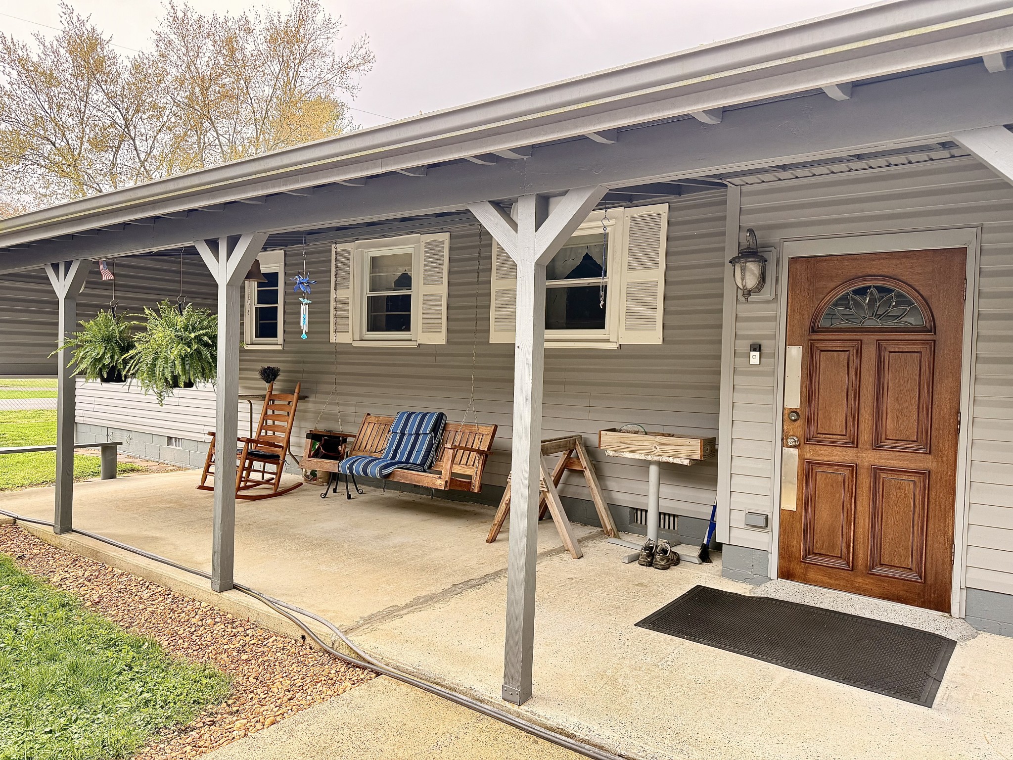111 Gentry Street Tullahoma, TN 37388 - Photo 12 of 66 a view of a patio with table and chairs and floor to ceiling window