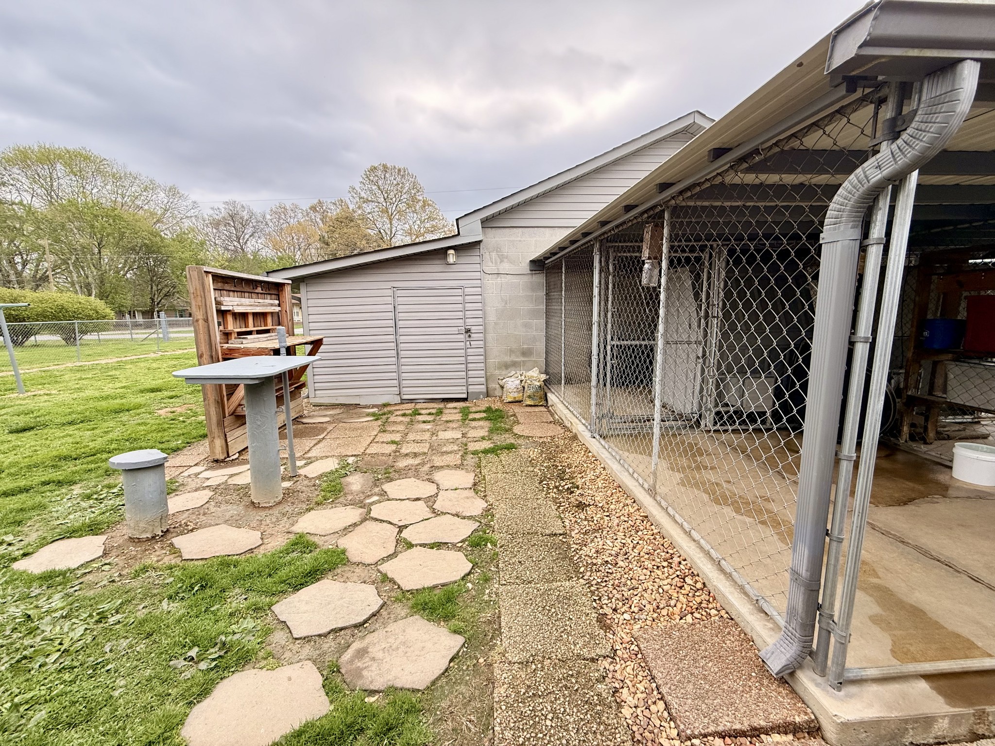 111 Gentry Street Tullahoma, TN 37388 - Photo 16 of 66 a view of a backyard with table and chairs