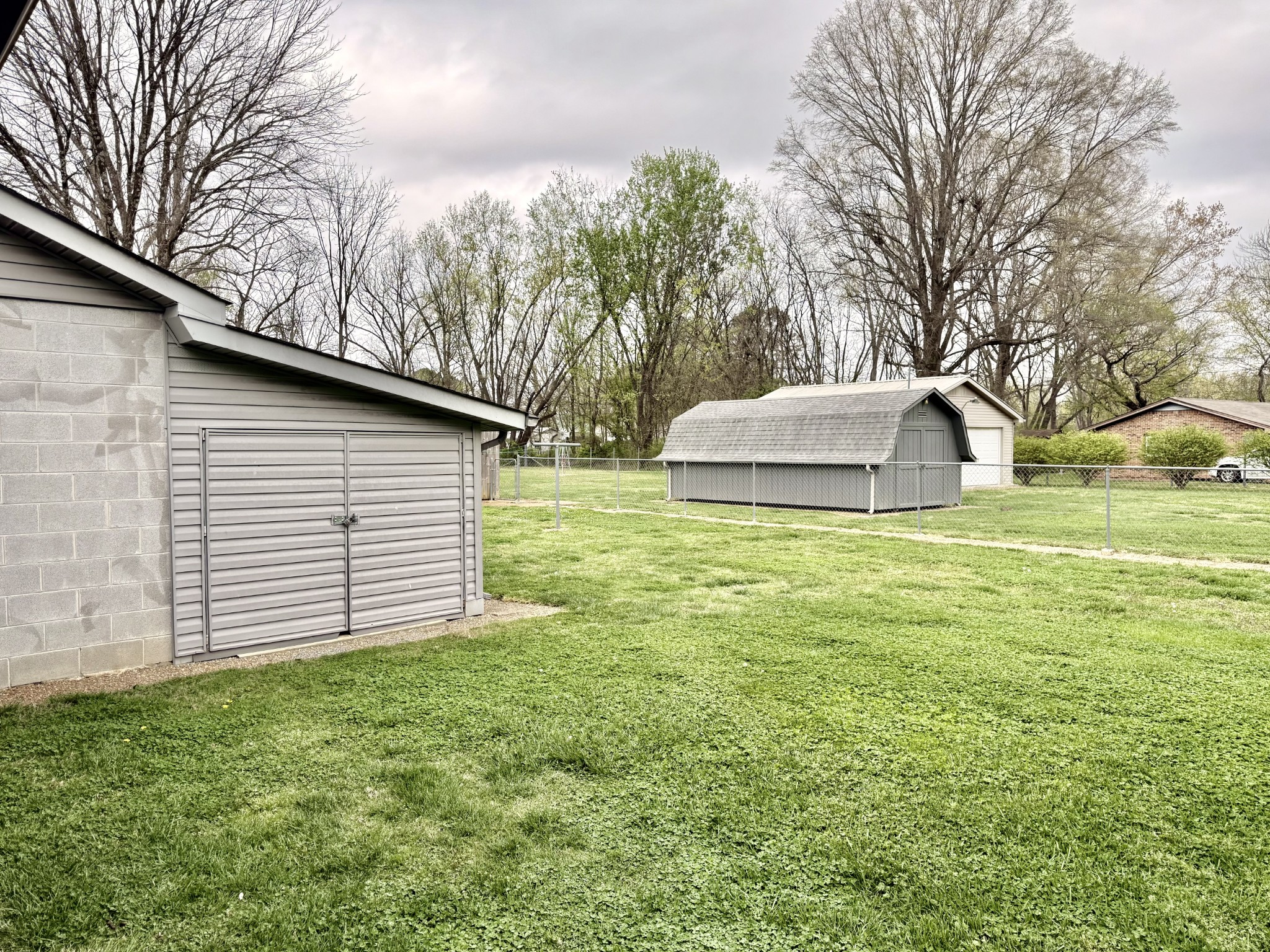 111 Gentry Street Tullahoma, TN 37388 - Photo 26 of 66 a white house that has tree in front of it