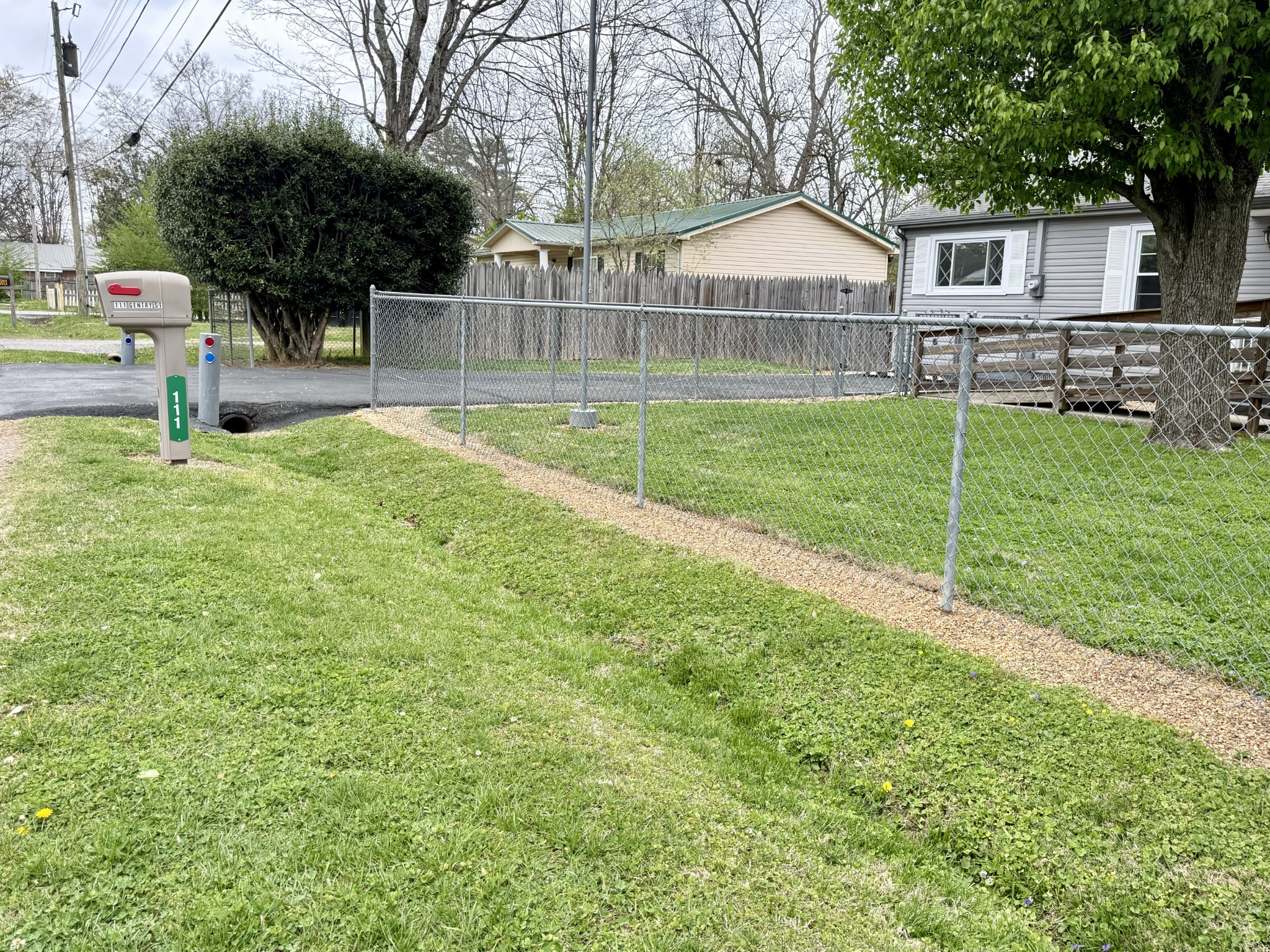 111 Gentry Street Tullahoma, TN 37388 - Photo 3 of 66 a view of a house with a backyard and a tree