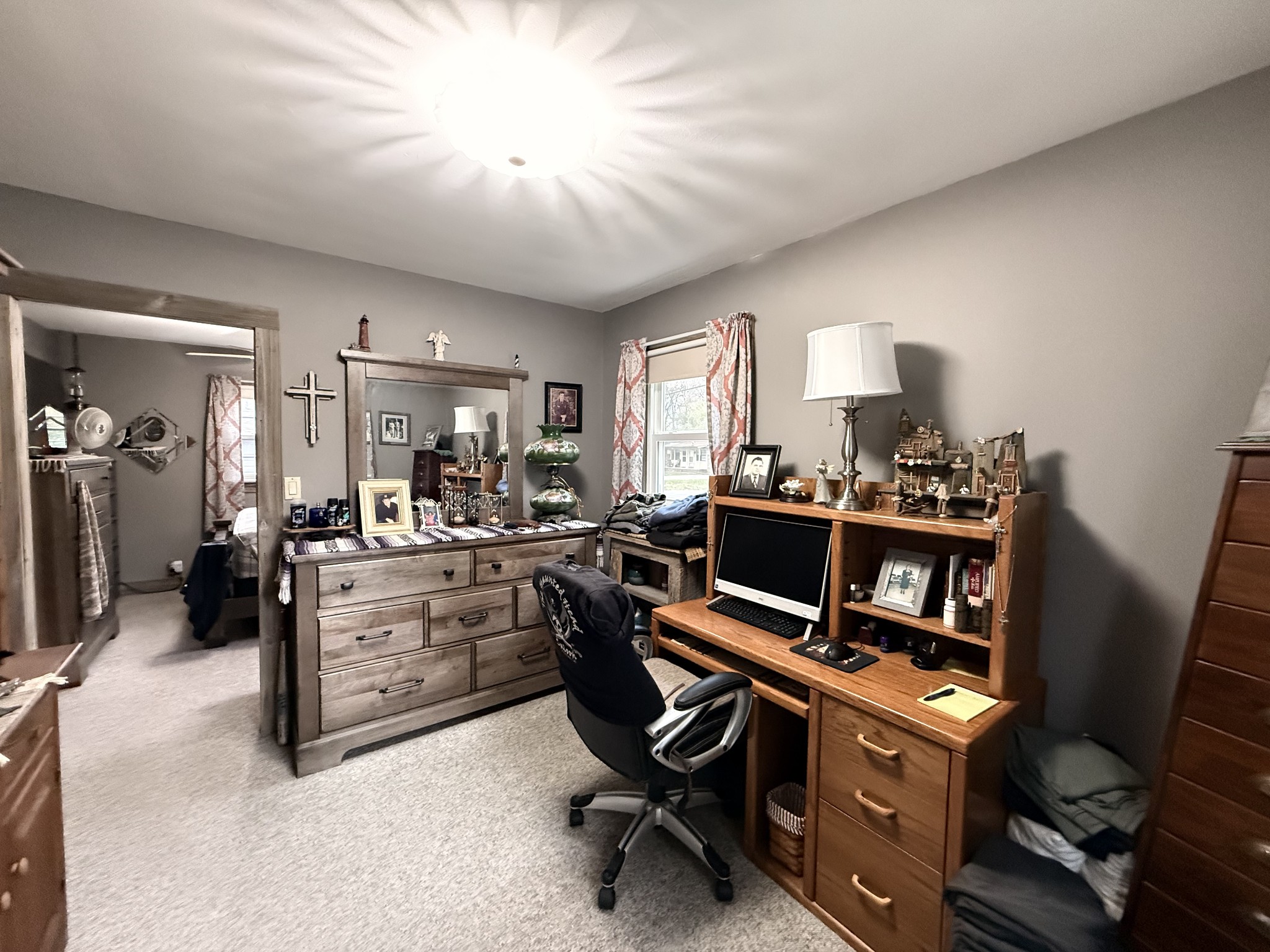 111 Gentry Street Tullahoma, TN 37388 - Photo 39 of 66 a room with furniture a piano and a bookshelf