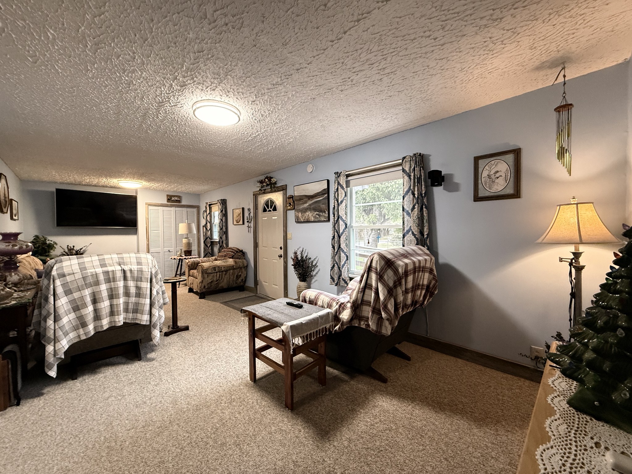 111 Gentry Street Tullahoma, TN 37388 - Photo 41 of 66 a bedroom with furniture and a flat screen tv