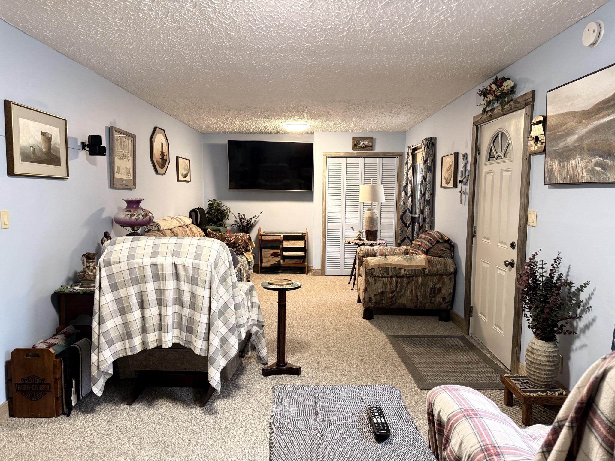 111 Gentry Street Tullahoma, TN 37388 - Photo 44 of 66 a bedroom with furniture and a flat screen tv