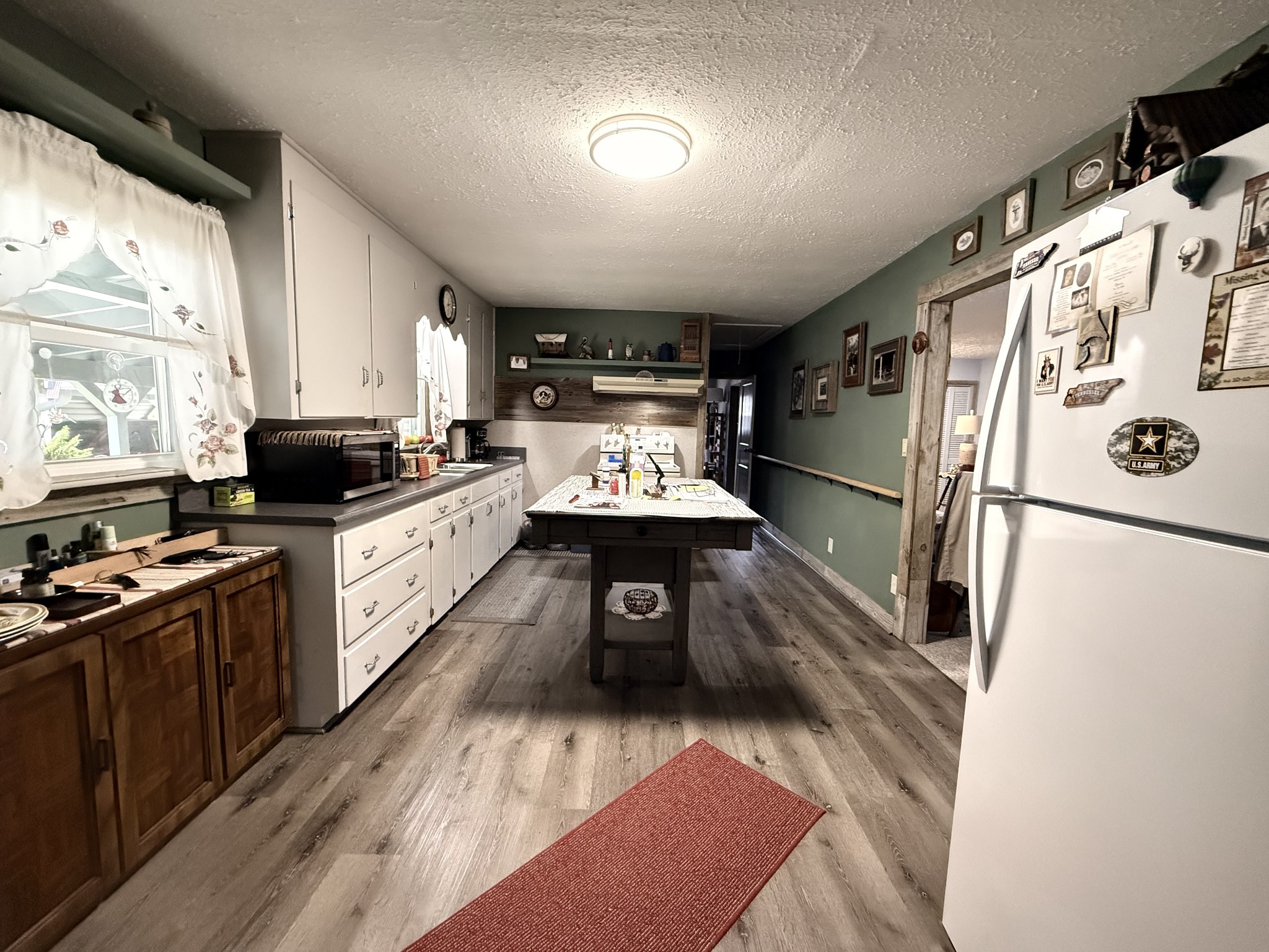 111 Gentry Street Tullahoma, TN 37388 - Photo 53 of 66 a kitchen with granite countertop a refrigerator stove and sink