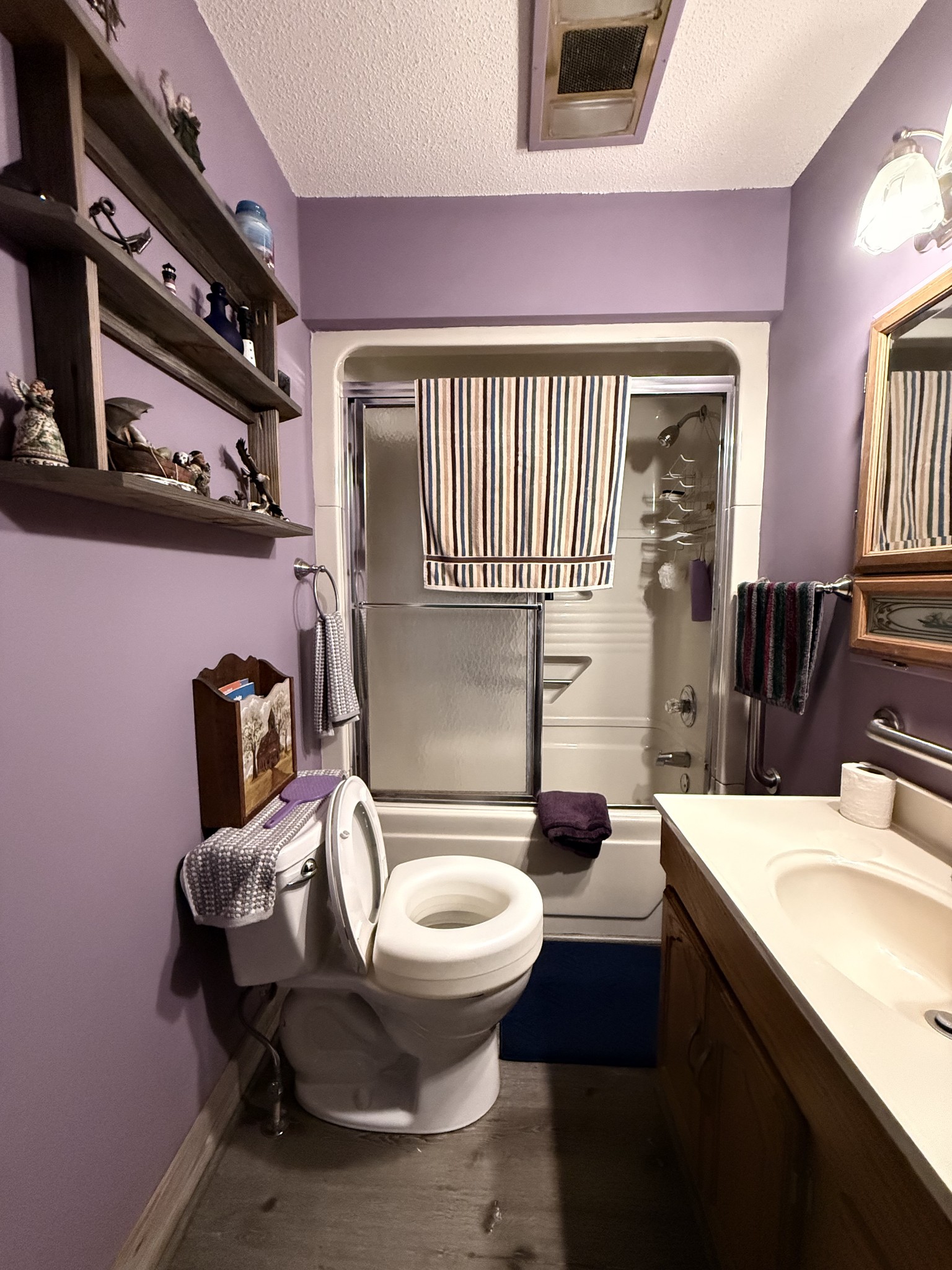 111 Gentry Street Tullahoma, TN 37388 - Photo 59 of 66 a bathroom with a sink a toilet and mirror