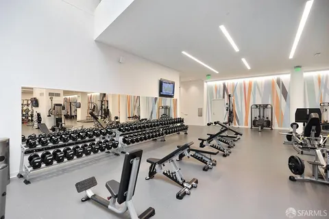 a view of a living room with gym equipment