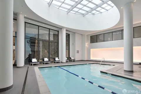 a lobby with furniture and floor to ceiling window