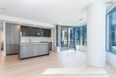 a view of a kitchen with a sink and cabinets