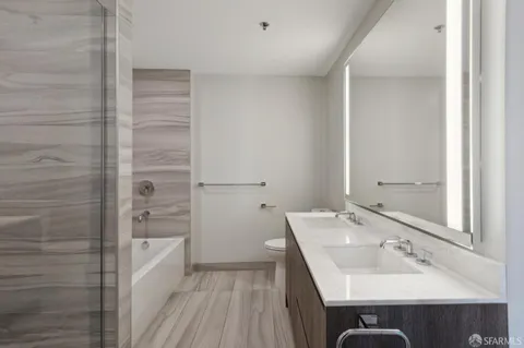 a bathroom with a shower and a sink