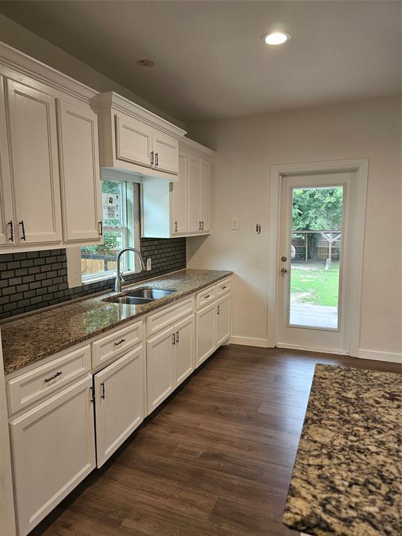 1704 Proctor Avenue Waco, TX 76708 - Photo 11 of 23 a large kitchen with granite countertop a sink and a stove