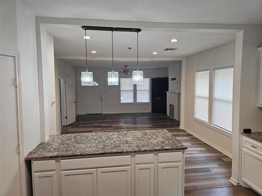 1704 Proctor Avenue Waco, TX 76708 - Photo 14 of 23 a view of a kitchen counter space and wooden floor