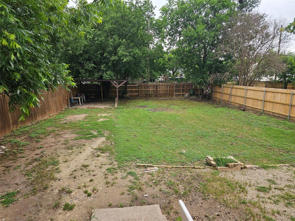 1704 Proctor Avenue Waco, TX 76708 - Photo 22 of 23 a backyard of a house with lots of green space