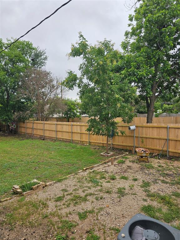 1704 Proctor Avenue Waco, TX 76708 - Photo 23 of 23 a backyard of a house with lots of green space