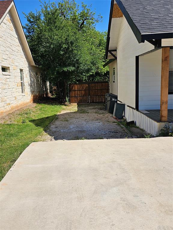 1704 Proctor Avenue Waco, TX 76708 - Photo 3 of 23 a view of a backyard with a garden