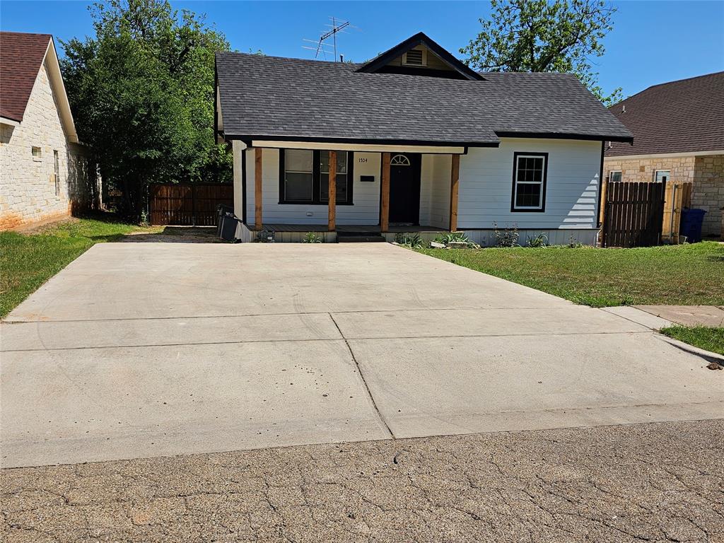 1704 Proctor Avenue Waco, TX 76708 - Photo 5 of 23 a front view of a house with a yard