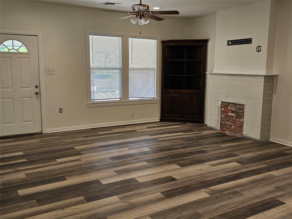1704 Proctor Avenue Waco, TX 76708 - Photo 7 of 23 a view of a livingroom with a fireplace