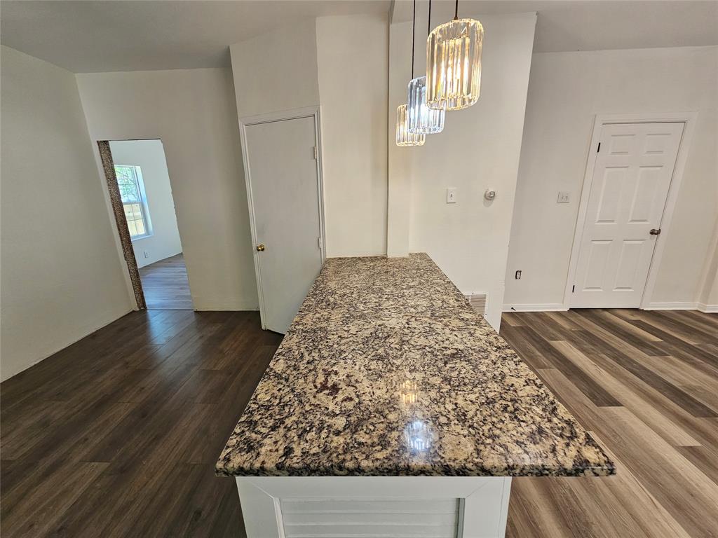 1704 Proctor Avenue Waco, TX 76708 - Photo 10 of 23 a view of empty room with wooden floor