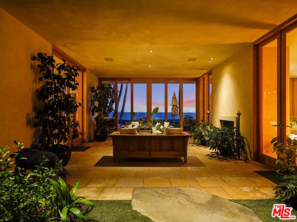 31280 Broad Beach Road Malibu, CA 90265 - Photo 19 of 43 a view of living room with patio furniture and potted plants