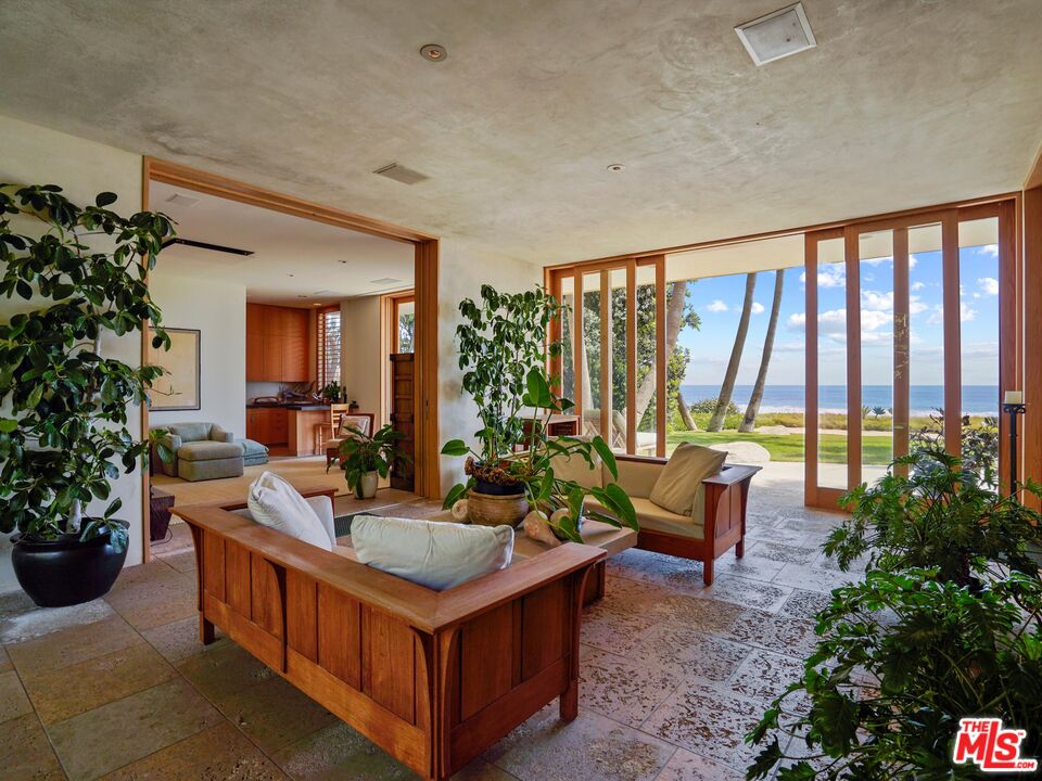 31280 Broad Beach Road Malibu, CA 90265 - Photo 20 of 43 a living room with furniture potted plant and a large window