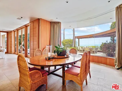 a large kitchen with stainless steel appliances granite countertop a stove a sink and a refrigerator