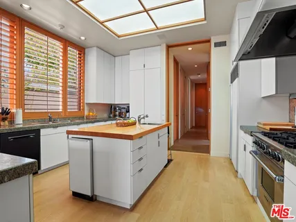 a view of a living room and floor to ceiling window or couch