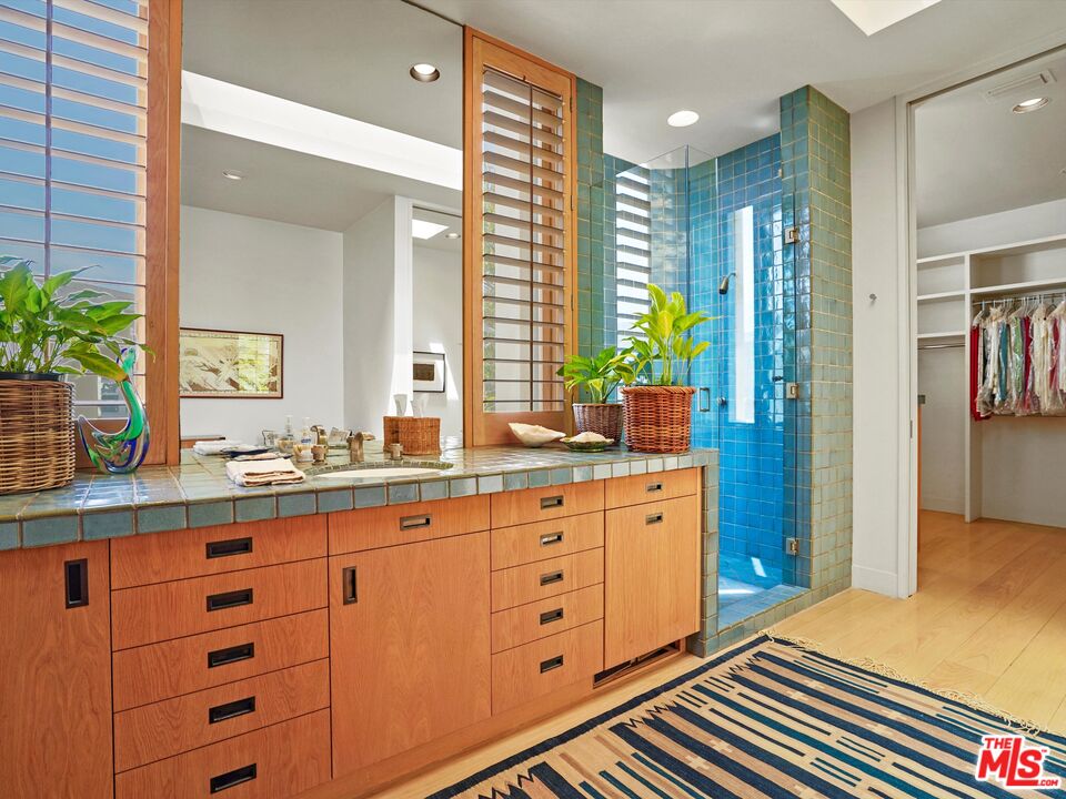 31280 Broad Beach Road Malibu, CA 90265 - Photo 31 of 43 a spacious bathroom with double vanity and a mirror