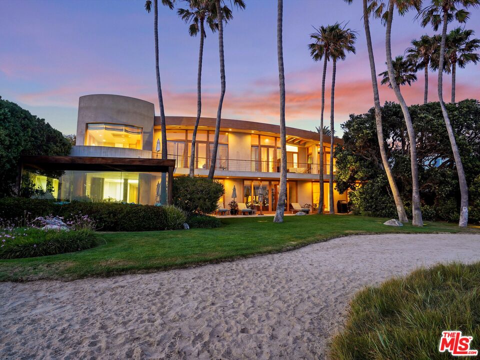 31280 Broad Beach Road Malibu, CA 90265 - Photo 42 of 43 a view of a house with a yard and palm trees