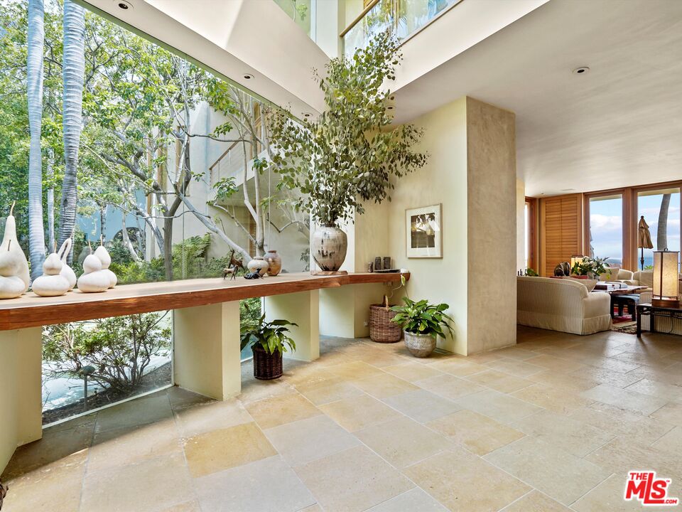 31280 Broad Beach Road Malibu, CA 90265 - Photo 10 of 43 a view of a chairs and table in a balcony