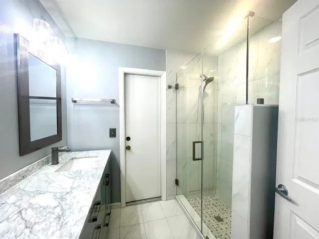 a view of an empty room with a window