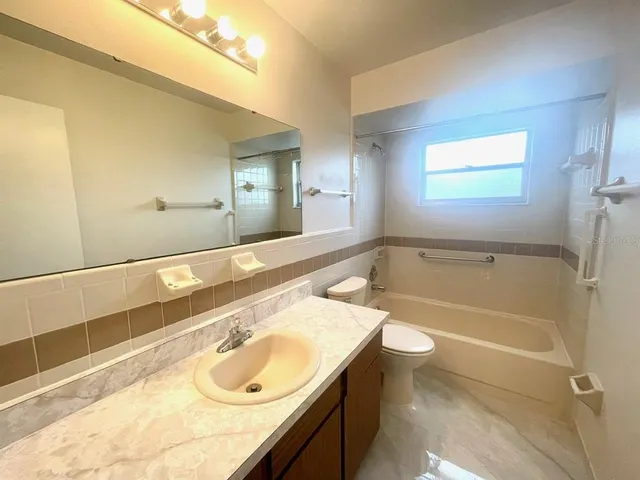 a view of an empty room with a large window