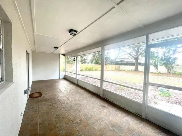 a view of an empty room with a large window