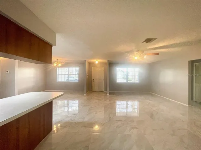 a view of entryway and kitchen