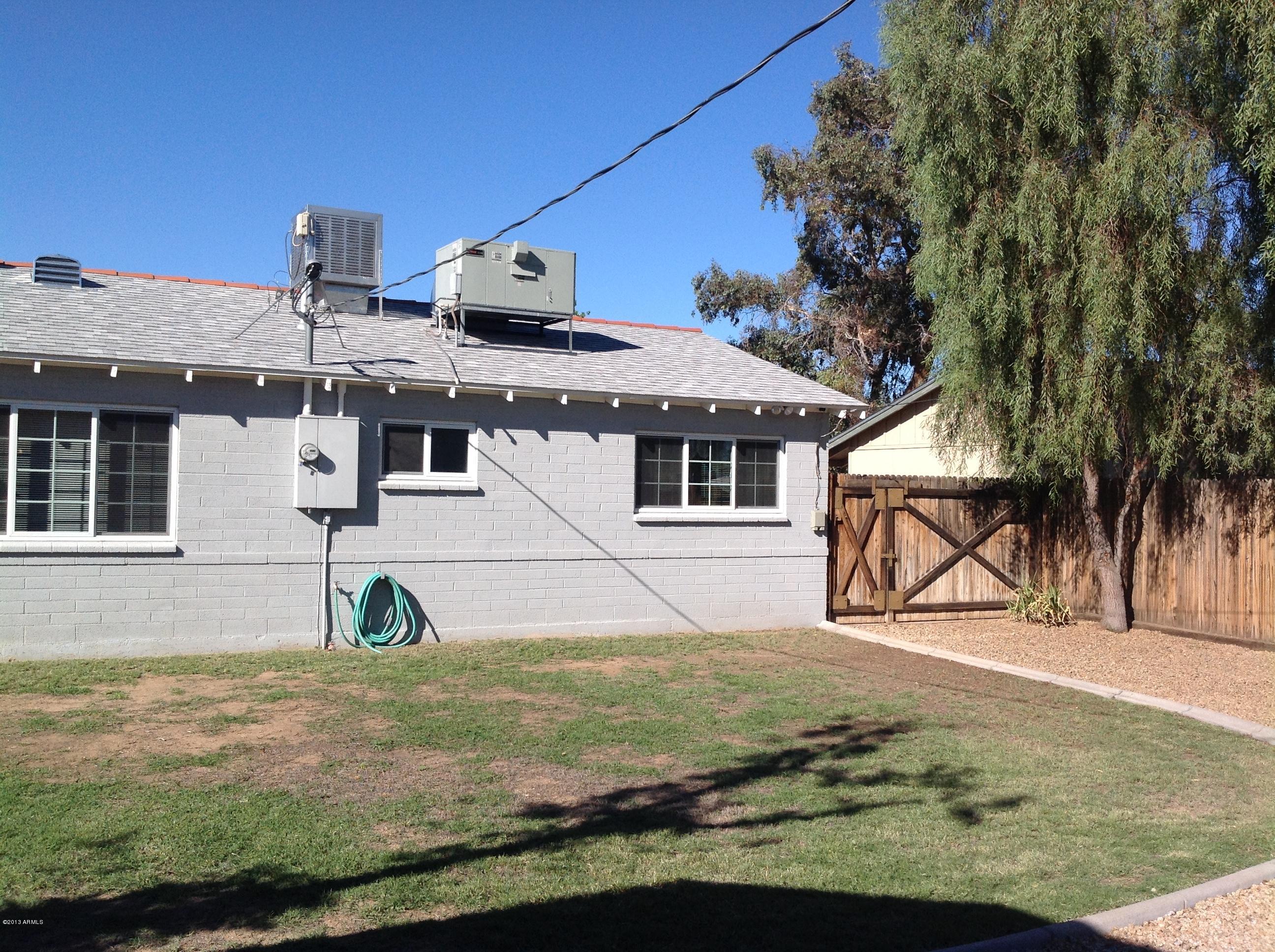 3411 West Wethersfield Road Phoenix, AZ 85029 - Photo 11 of 21 Backyard and large gate