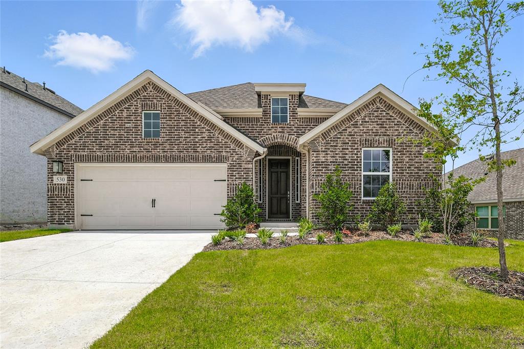 530 Red Barn Drive Van Alstyne, TX 75495 - Photo 1 of 40 View of front of house with brick siding, a front yard, driveway, roof with shingles, and an attached garage