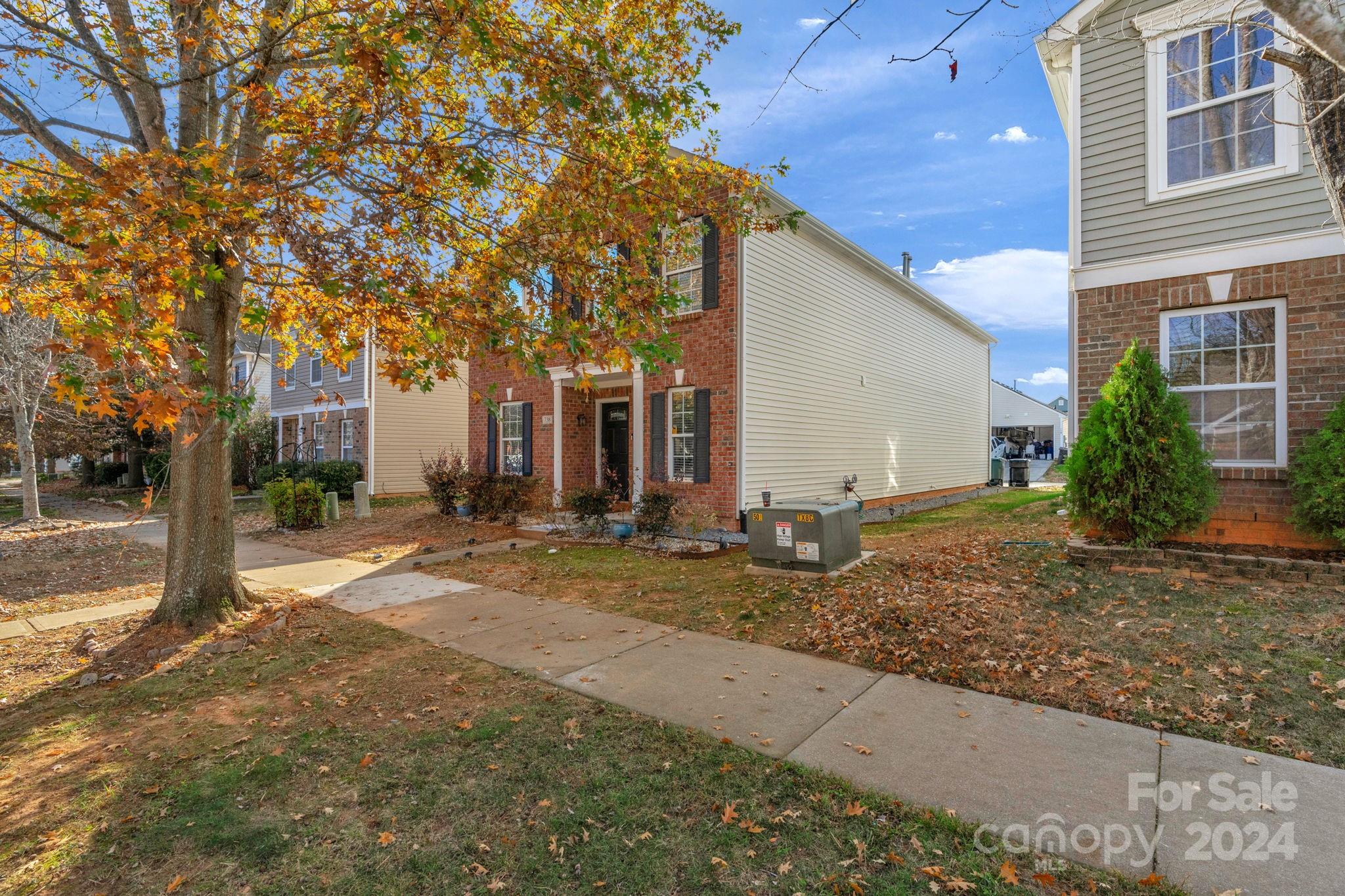 a backyard of a house with yard and outdoor seating
