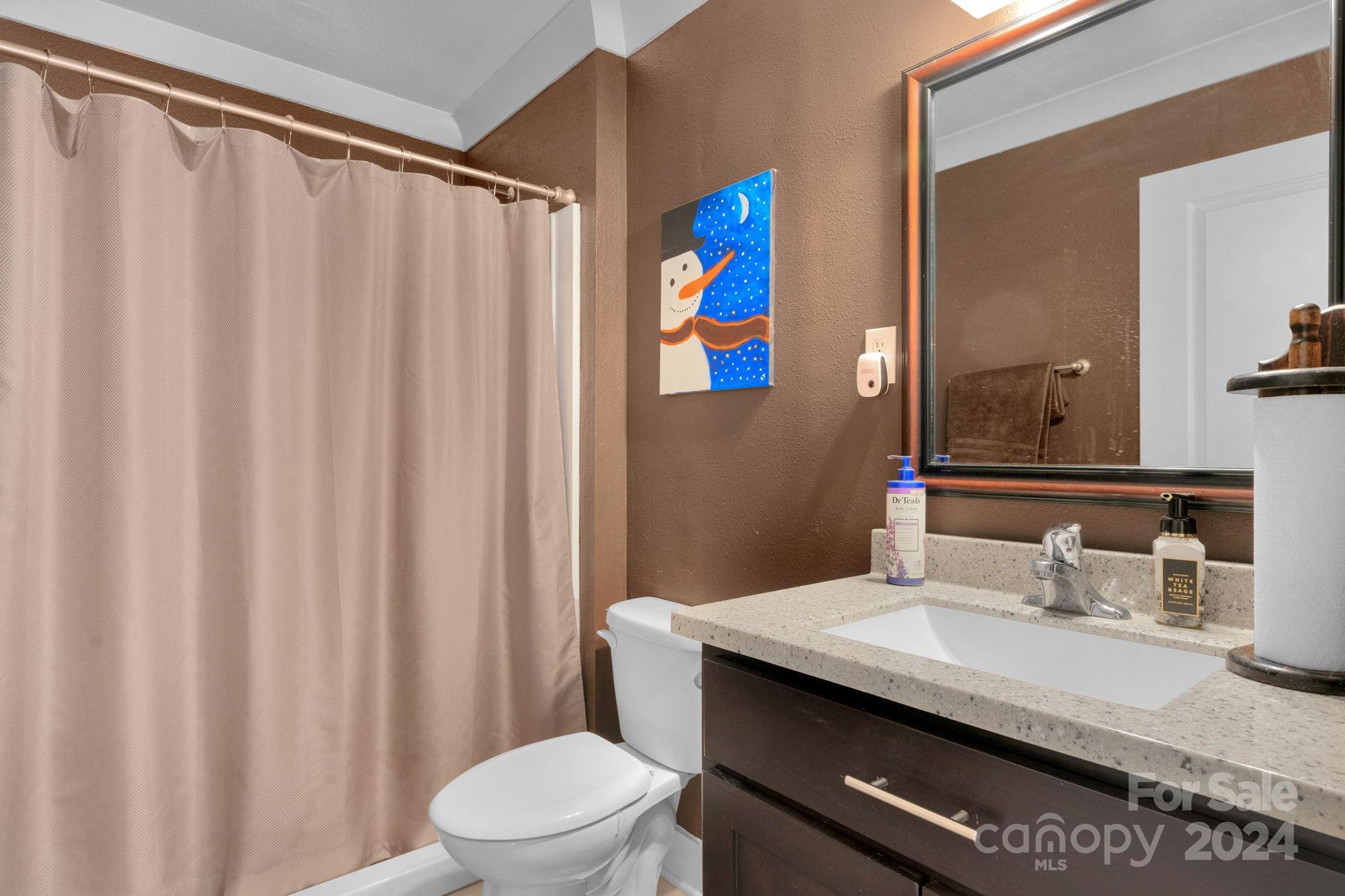738 Sinclair Drive Monroe, NC 28112 - Photo 16 of 33 a bathroom with a granite countertop sink and a mirror
