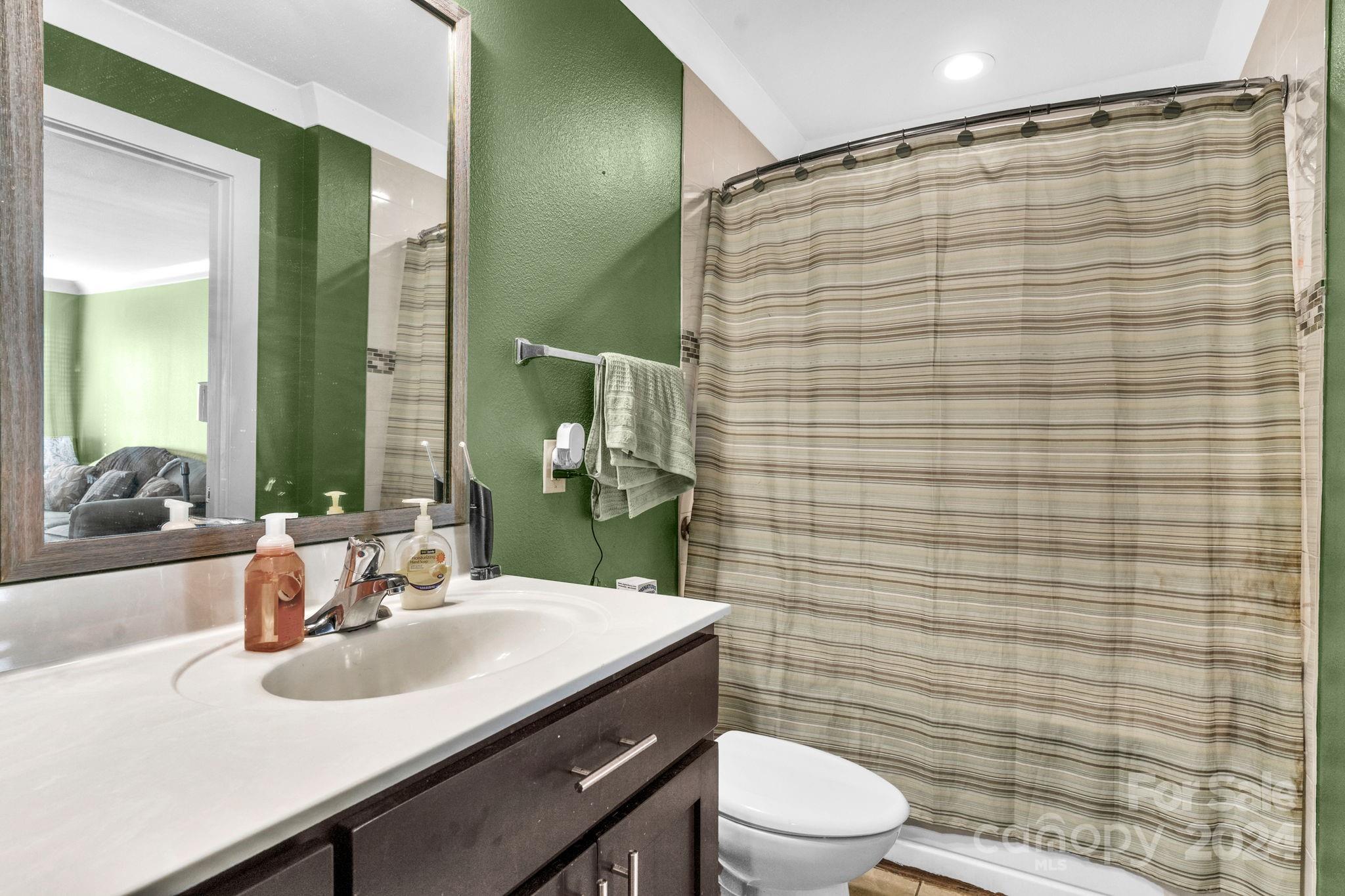 738 Sinclair Drive Monroe, NC 28112 - Photo 26 of 33 a bathroom with a sink a toilet and shower