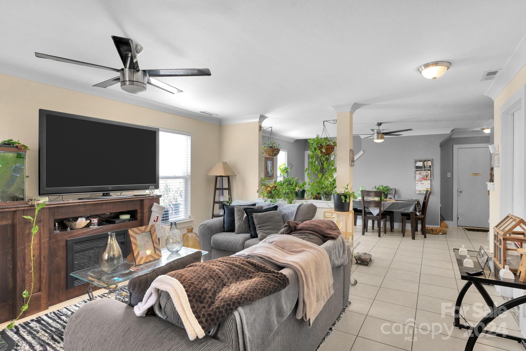 738 Sinclair Drive Monroe, NC 28112 - Photo 3 of 33 a living room with furniture and a flat screen tv