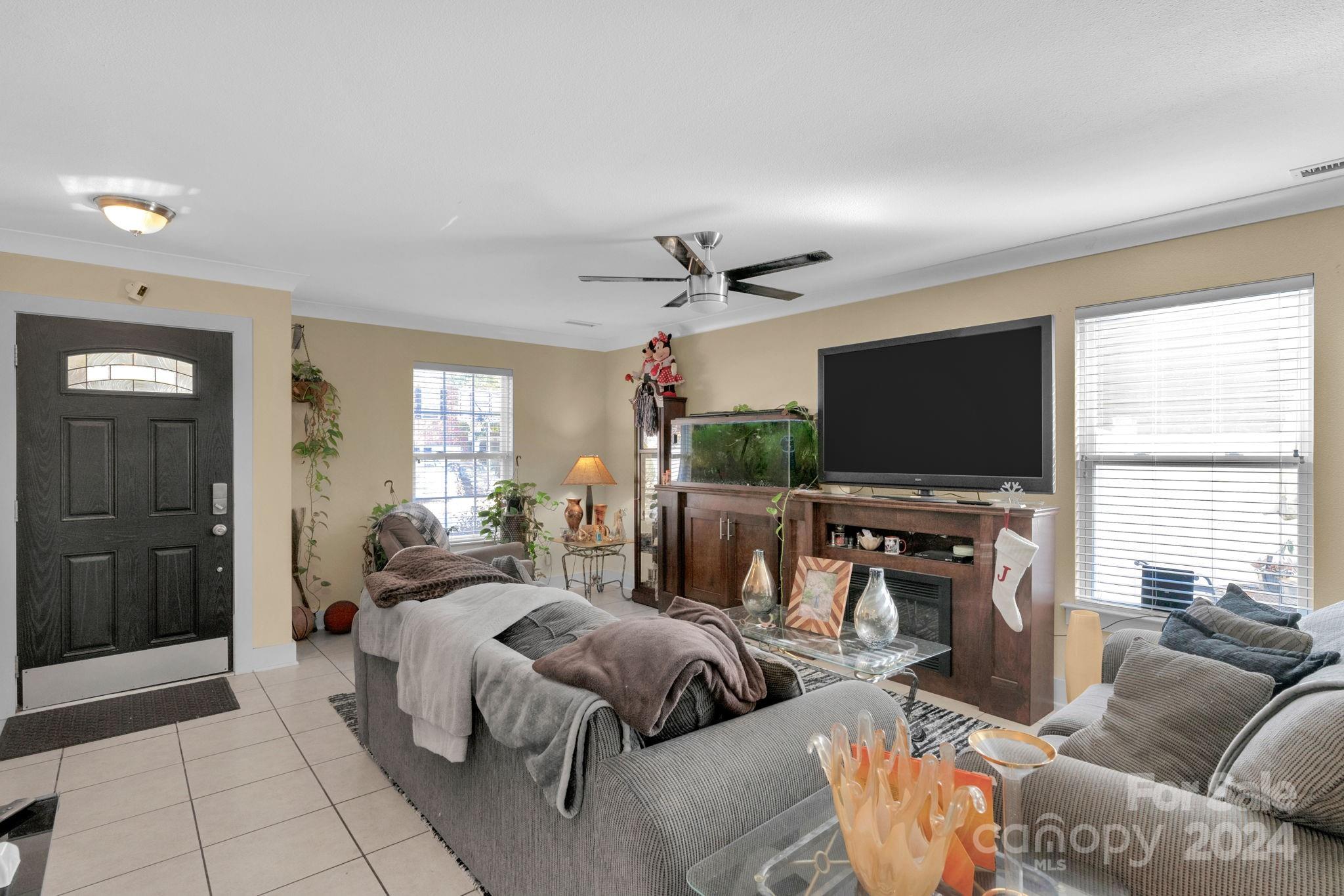 738 Sinclair Drive Monroe, NC 28112 - Photo 5 of 33 a living room with furniture and a flat screen tv
