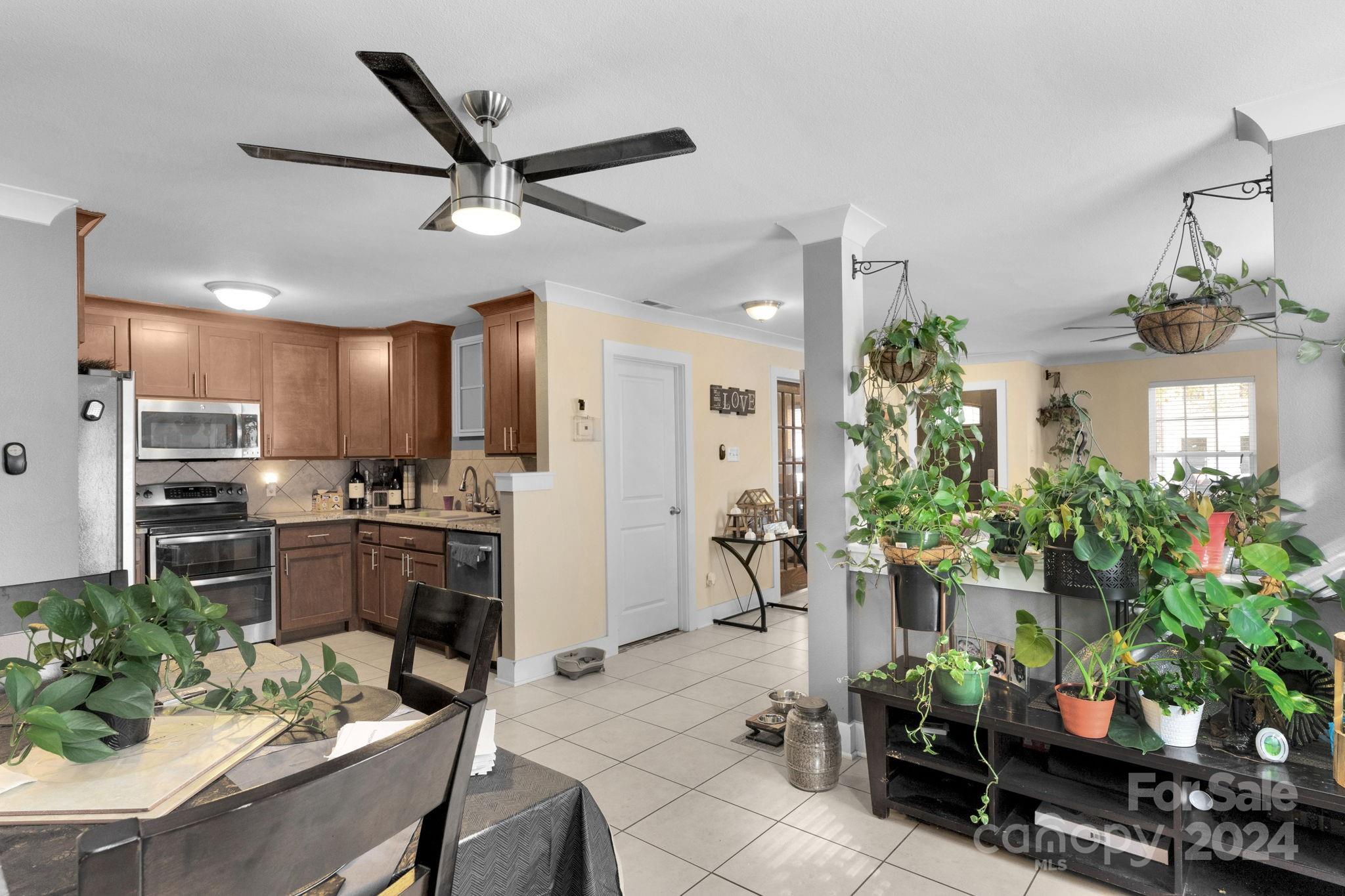 738 Sinclair Drive Monroe, NC 28112 - Photo 10 of 33 a kitchen with counter top space and living room