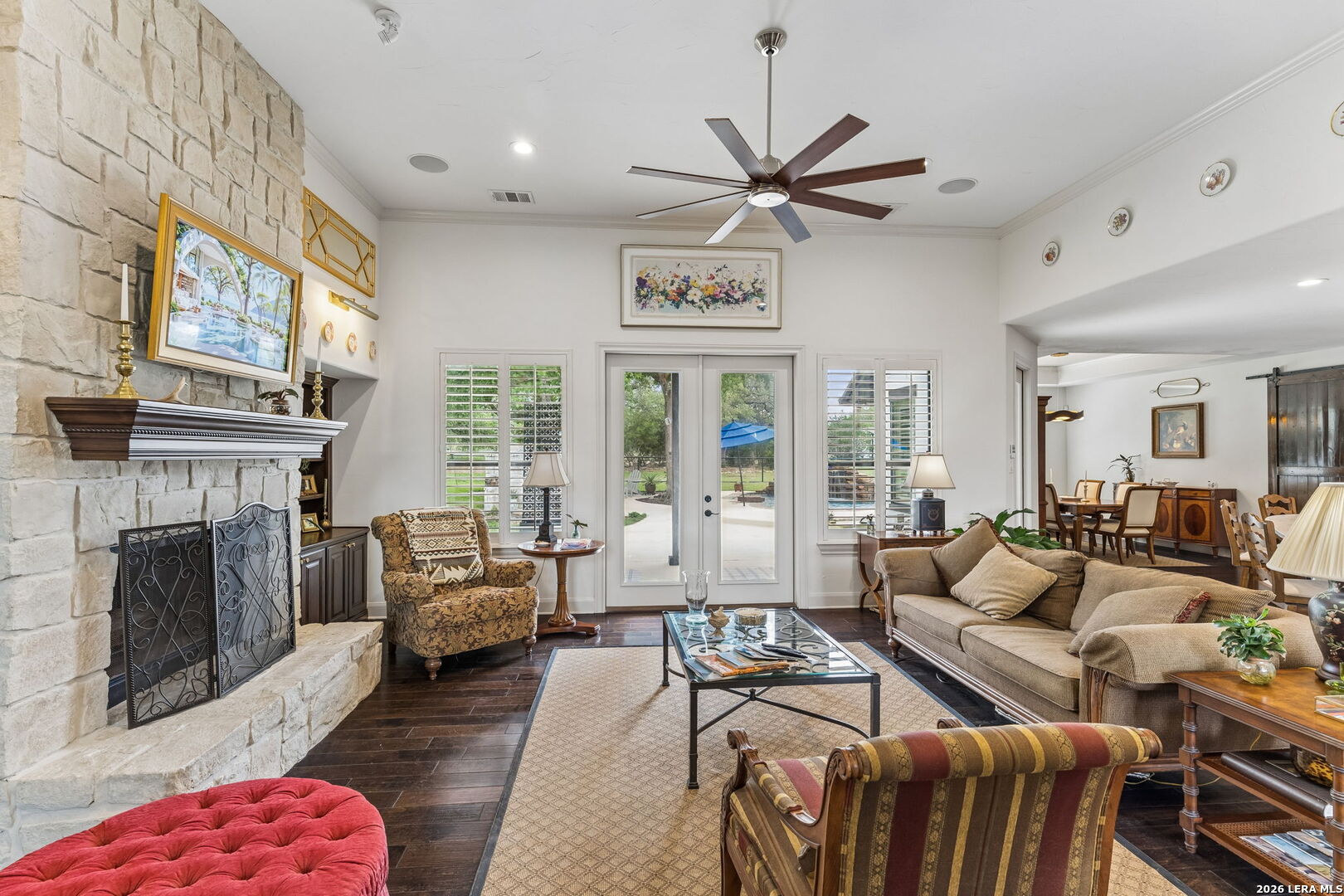 1330 Palmetto Point Spring Branch, TX 78070 - Photo 16 of 43 a living room with furniture a fireplace and a floor to ceiling window