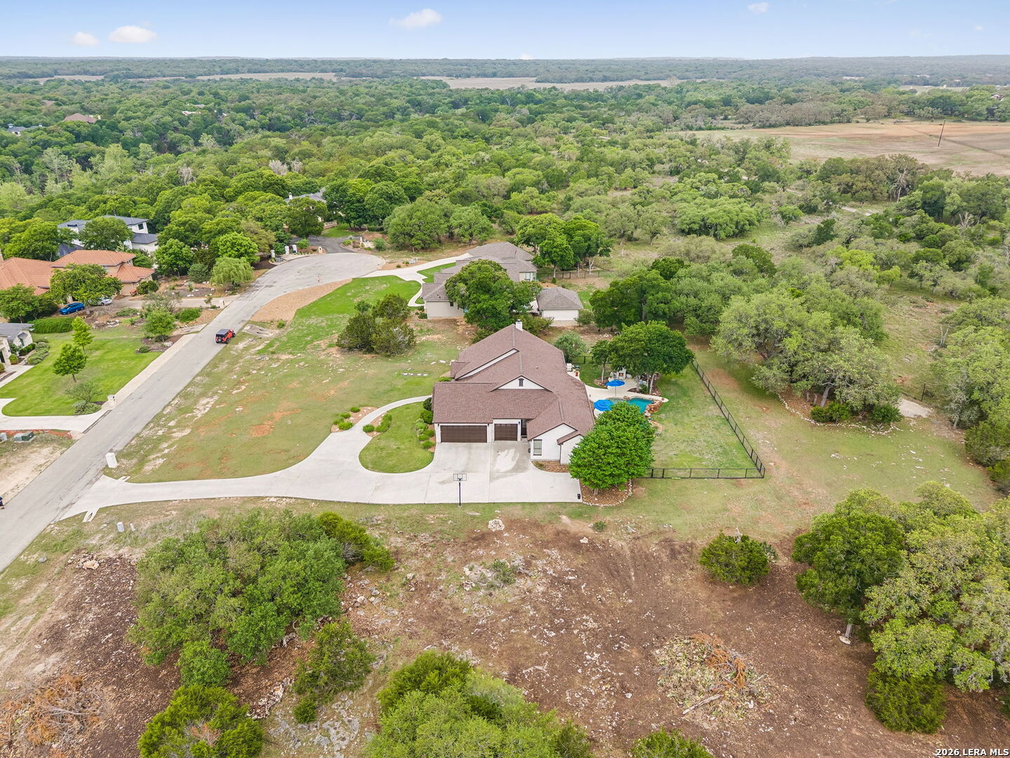 1330 Palmetto Point Spring Branch, TX 78070 - Photo 38 of 43 an aerial view of residential houses with outdoor space and trees
