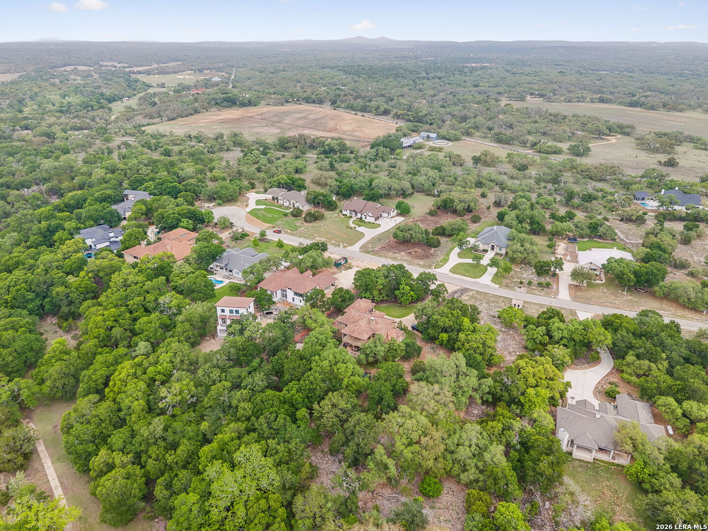 1330 Palmetto Point Spring Branch, TX 78070 - Photo 40 of 43 an aerial view of residential houses with outdoor space and trees