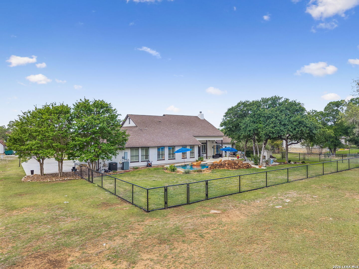 1330 Palmetto Point Spring Branch, TX 78070 - Photo 41 of 43 a view of a tennis ground with a large trees