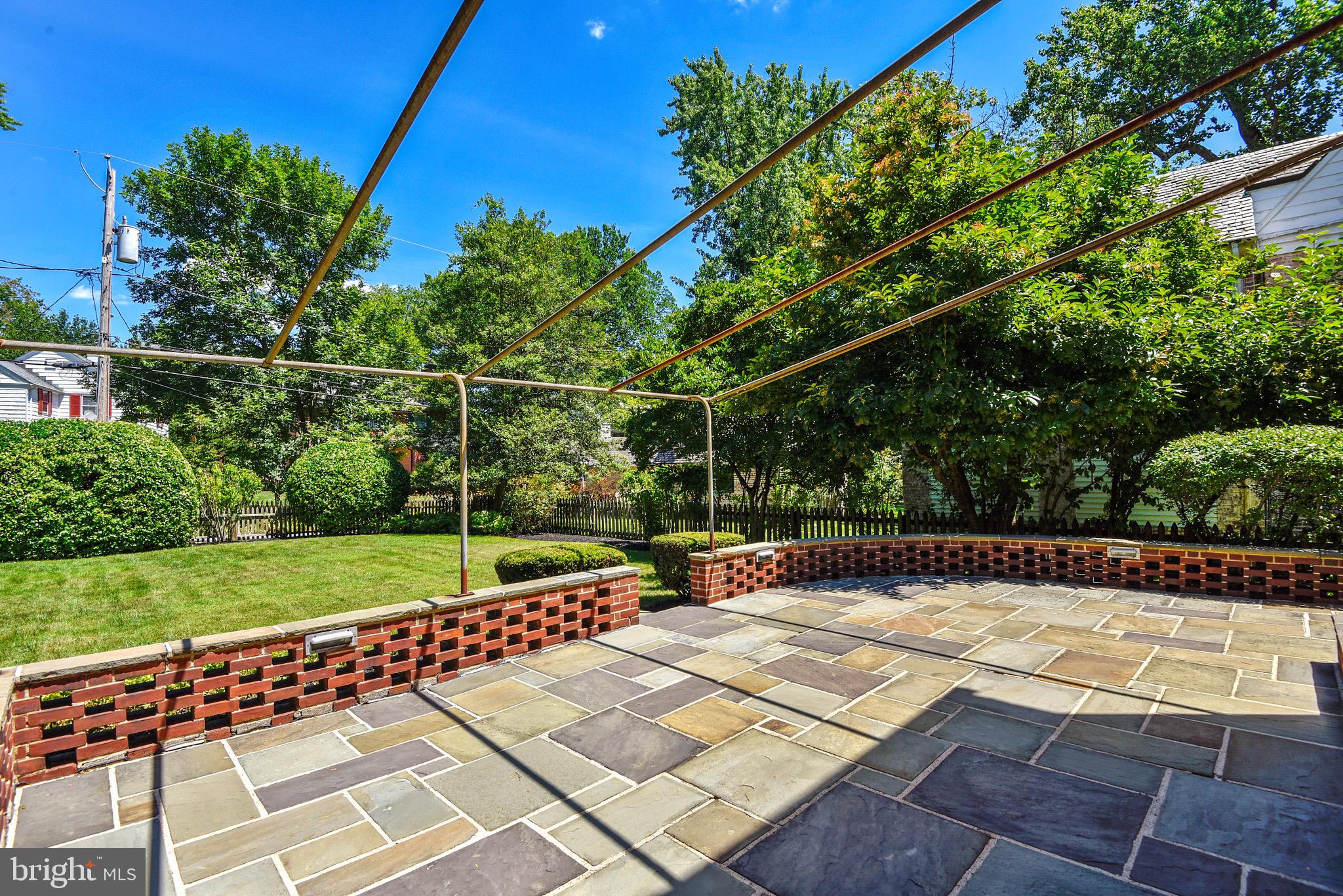 5105 Springlake Way Baltimore, MD 21212 - Photo 55 of 57 Large blue stone patio and brick wall