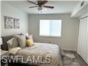 3120 Seasons Way, Unit 309 Estero, FL 33928 - Photo 11 of 33 a bedroom with a bed and a window
