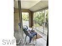 3120 Seasons Way, Unit 309 Estero, FL 33928 - Photo 14 of 33 a view of a room with furniture and large windows