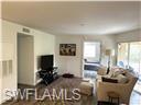 3120 Seasons Way, Unit 309 Estero, FL 33928 - Photo 2 of 33 a living room with furniture and a flat screen tv