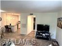 3120 Seasons Way, Unit 309 Estero, FL 33928 - Photo 4 of 33 a living room with furniture and a flat screen tv