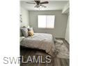 3120 Seasons Way, Unit 309 Estero, FL 33928 - Photo 10 of 33 a bedroom with a bed and a window